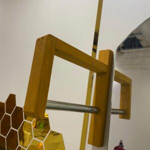 Wall mounted hanger designed for hanging dresses – sturdy, space-saving solution with a sleek design for organized clothing storage.